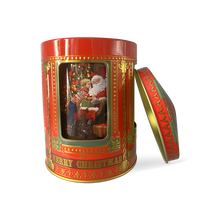 Indlæs billede til gallerivisning Rød kagedåse i form af en spilledåse med julemotive. Her ses julemanden og en lille dreng. Låget er taget af
